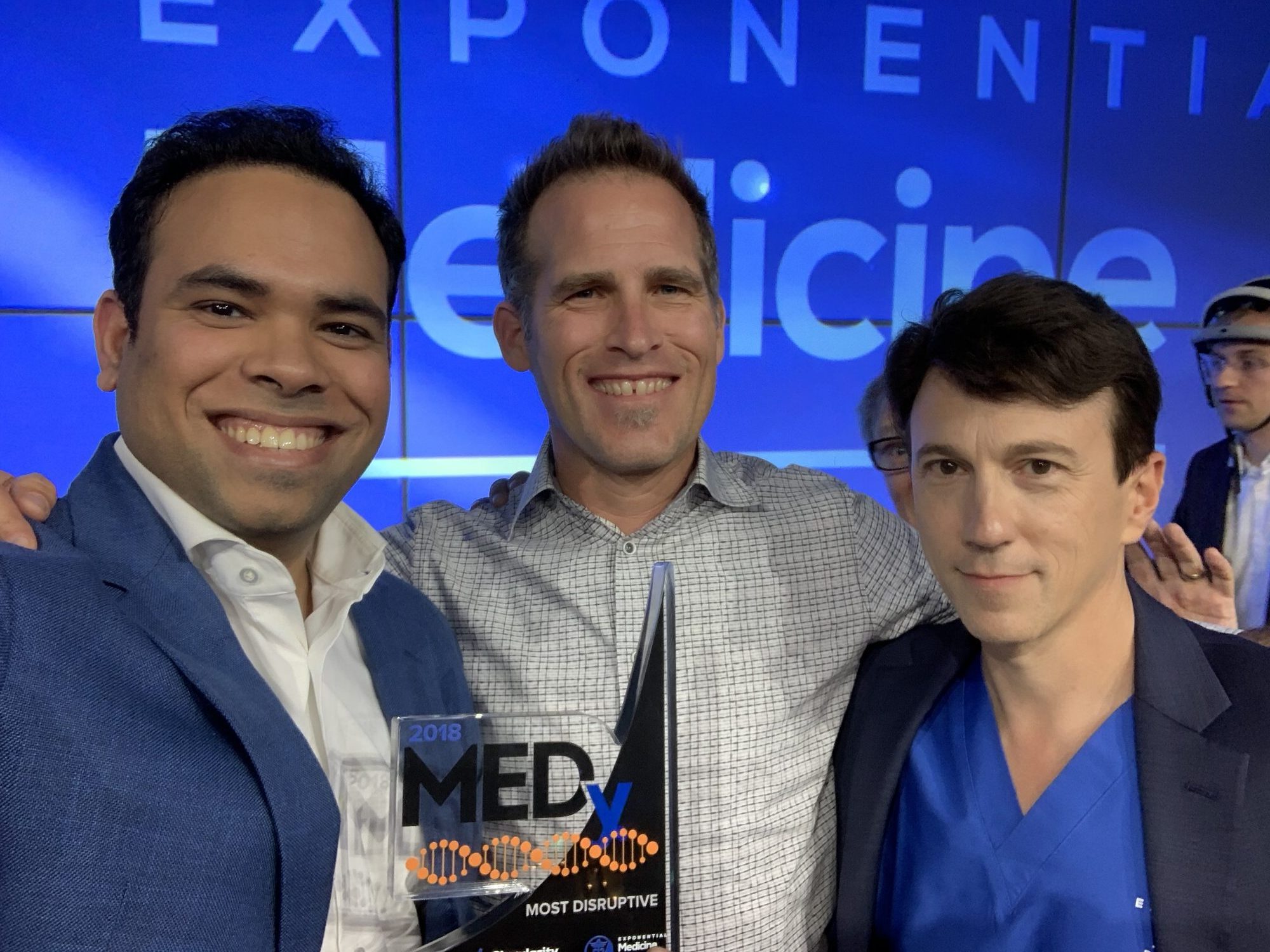 AIDAR Health team holding the MEDy Most Disruptive award at Exponential Medicine.